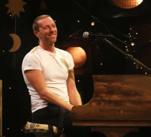 Watch Chris Martin's Surprise Performance At A Quaint